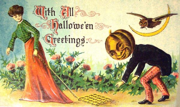 Vintage halloween card with woman and man with a pumpkin head
